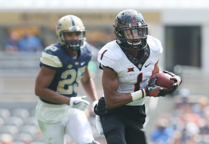 Oklahoma State wide receiver Jalen McCleskey (1) runs after a catch against the Pitt Panthers. Mandatory Credit: Charles LeClaire-USA TODAY